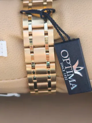 Reloj Optima Negro y Dorado Mujer Negociable