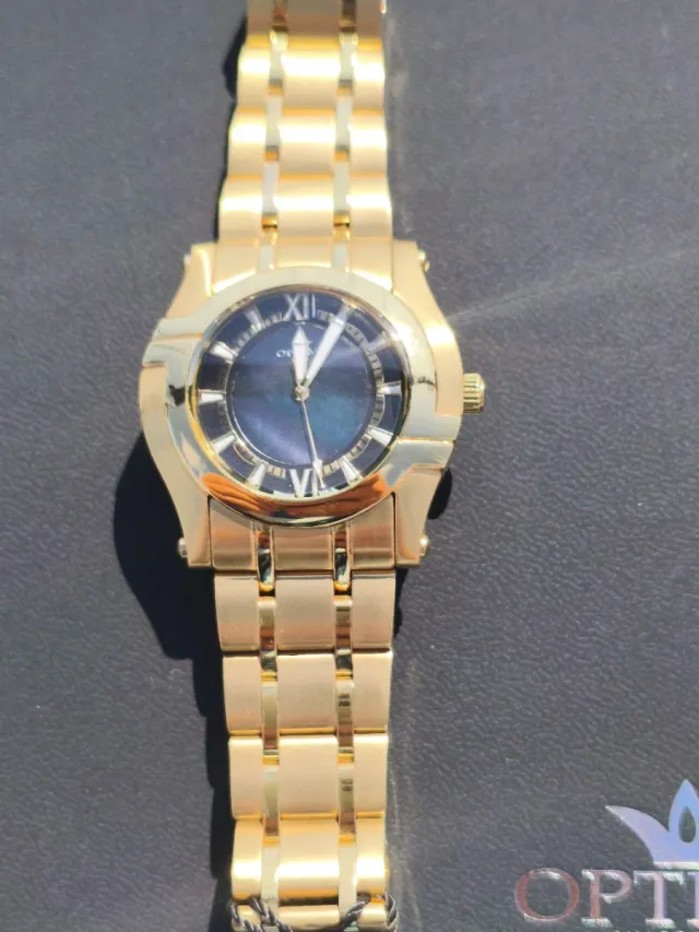 Reloj Optima Negro y Dorado Mujer Negociable