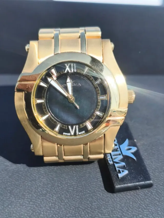 Reloj Optima Negro y Dorado Mujer Negociable