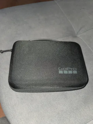 Carcasa GoPro con accesorios y flotador