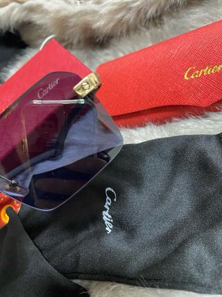 Gafas de sol Cartier negras y doradas