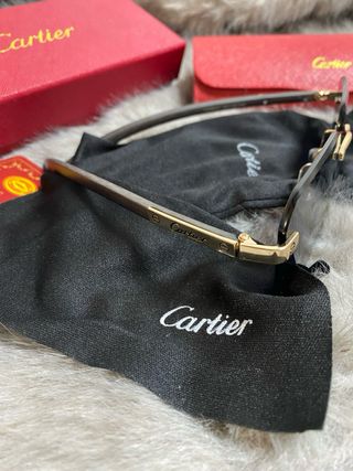 Gafas de sol Cartier negras y doradas