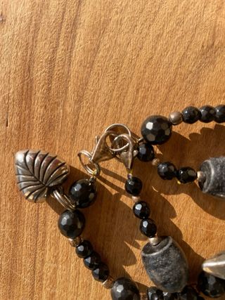 Set bracciali neri e argento con stella