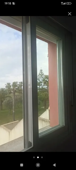 Ventana Climalit con persiana y mosquitera