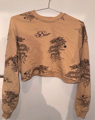 Sudadera corta beige con dragones