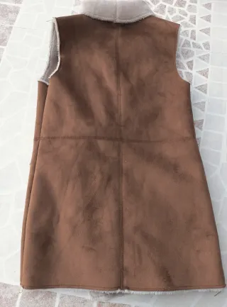 Chaleco imitación piel vuelta
