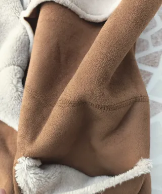 Chaleco imitación piel vuelta