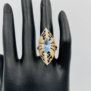 LANZADERA GRANDE PIEDRA AZUL. Oro 18k.