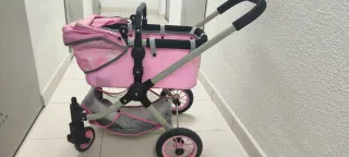 Carrito de muñecas rosa