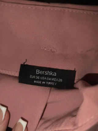 Pantalón rosa de pinzas con cinturón