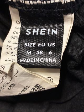 Body manga larga con escote asimétrico