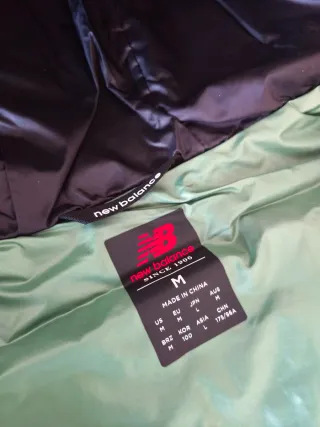 Chaqueta New Balance acolchada verde