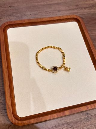 Pulsera elástica ojo de tigre y cuentas doradas