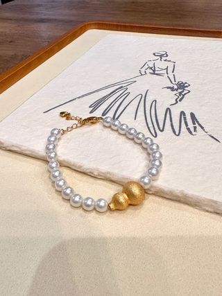 Pulsera perlas con calabaza dorada