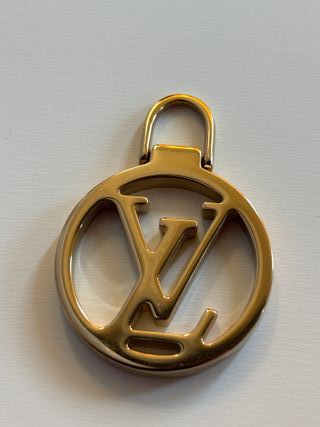 Tiralampo Louis Vuitton Oro zip borse abbigliament