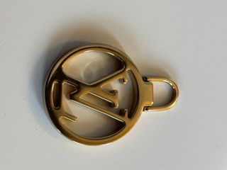 Tiralampo Louis Vuitton Oro zip borse abbigliament