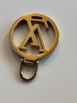 Tiralampo Louis Vuitton Oro zip borse abbigliament