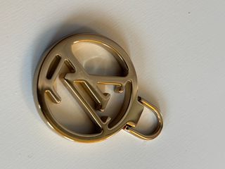 Tiralampo Louis Vuitton Oro zip borse abbigliament