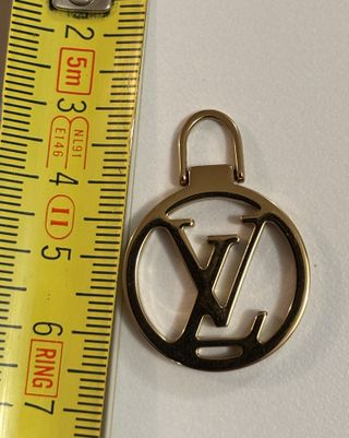 Tiralampo Louis Vuitton Oro zip borse vestiti moda