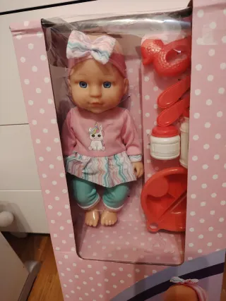 Muñeca con balancín caballito