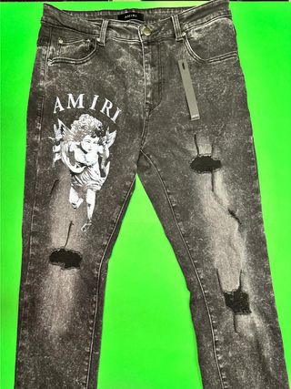 Jeans Amiri neri con stampa angelo