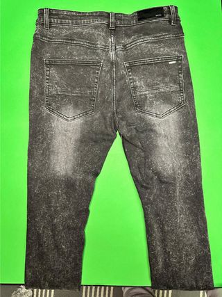 Jeans Amiri neri con stampa angelo