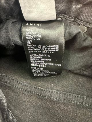 Jeans Amiri neri con stampa angelo