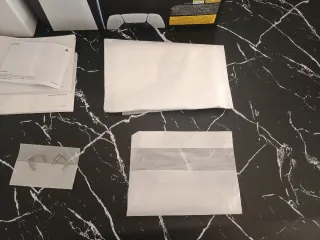 Caja PS5 Digital Edition con manuales