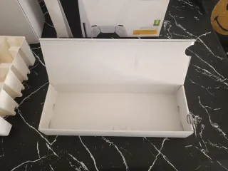 Caja PS5 Digital Edition con manuales