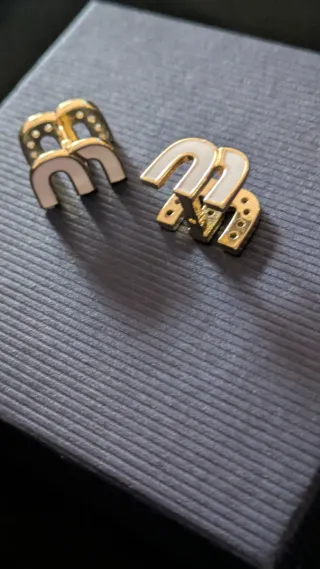 Orecchini Miu Miu in acciaio placcato oro e Zircon