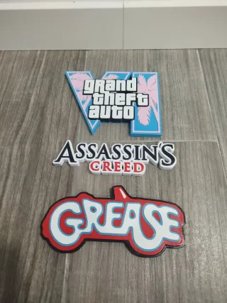Logos GTA, Assassin's Creed, Grease