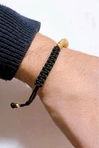 Bracciale in stoffa con sfere lucide oro 18kt