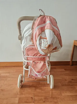 Cochecito de muñeca doble rosa + muñeco de vinilo