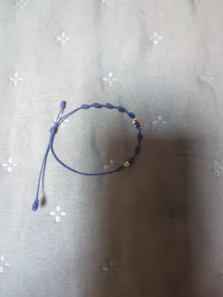 Pulsera plata trébol cordón azul nueva