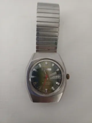 Reloj de pulsera plateado y verde No funciona