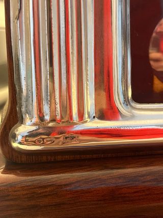 Reloj de péndulo antiguo de plata