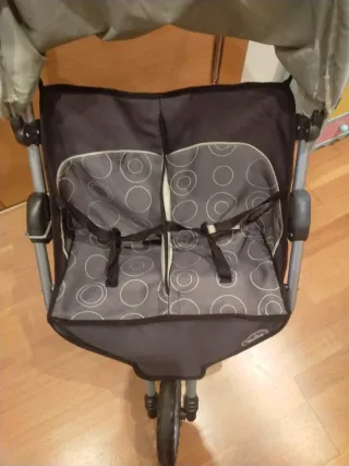 Cochecito gemelar gris