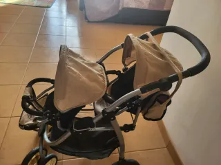 Cochecito gemelar de juguete