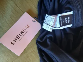 Mono negro elegante para fiesta Nuevo