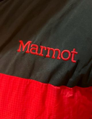 Chaqueta alta montaña Marmot roja y negra