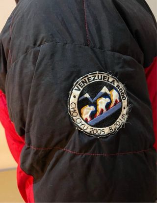 Chaqueta alta montaña Marmot roja y negra