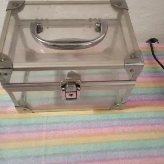 Caja joyero transparente con asa