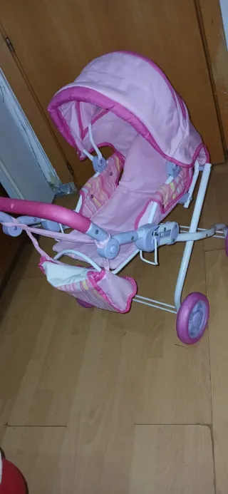 Carrito de muñecas rosa