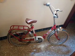 Bicicleta roja plegable  Orbea. Para niño/niiña.