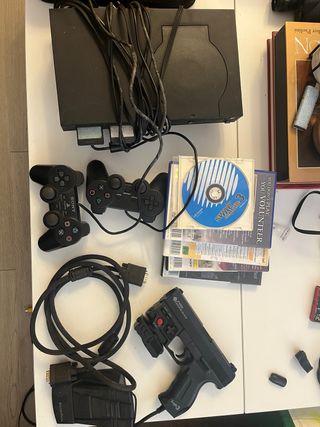 Console PS2 nera con giochi e accessori