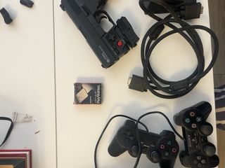 Console PS2 nera con giochi e accessori