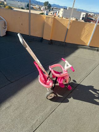 Triciclo niña rosa con empujador