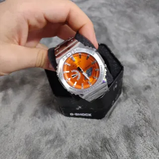 Reloj Casio de acero con dial naranja