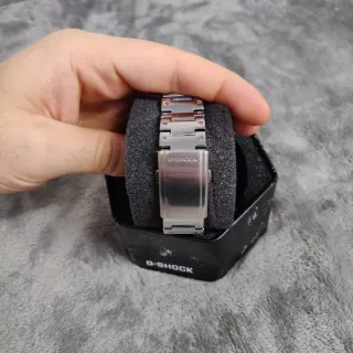 Reloj Casio de acero con dial naranja