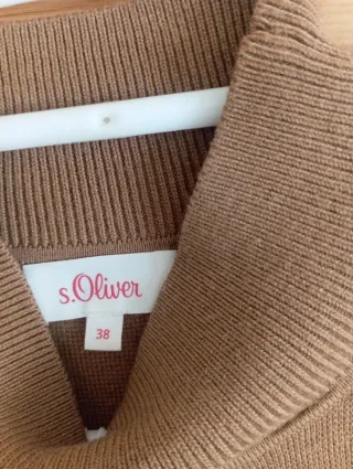 Chaleco punto cuello alto lazada lateral